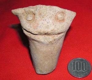 Excavated artifact resembles kappa head?